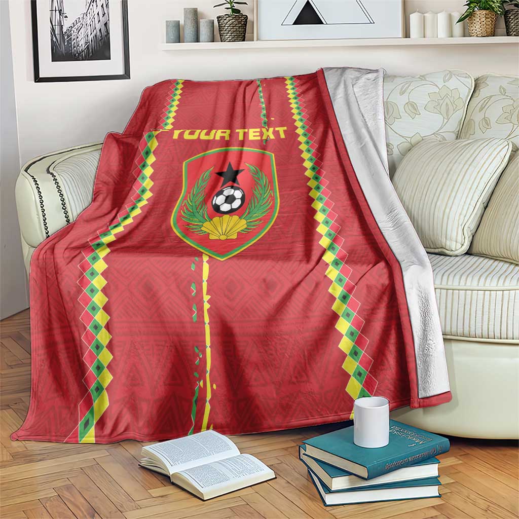 Red football blanket with green-and-yellow border and crest graphic; personalized text panel.