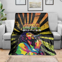 Bob Marley grunge style blanket draped on sofa, black/yellow rays with colorful portrait mic