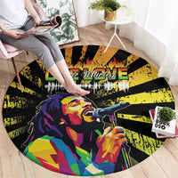 Black round rug featuring reggae-style singer with microphone, bold yellow and flame graphics
