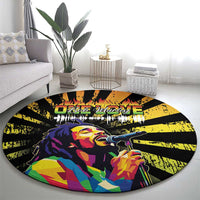 Black round rug with colorful reggae portrait and microphone, yellow rays and flame stripes