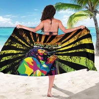 Black reggae-style sarong with yellow and green stripe pattern and portrait graphic (back view)