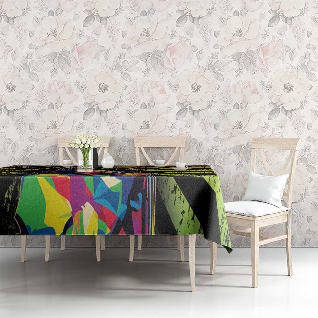 Rectangular tablecloth with colorful abstract blocks on black-and-green base, on dining set