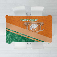 Orange and green custom tablecloth with elephant crest and striped border