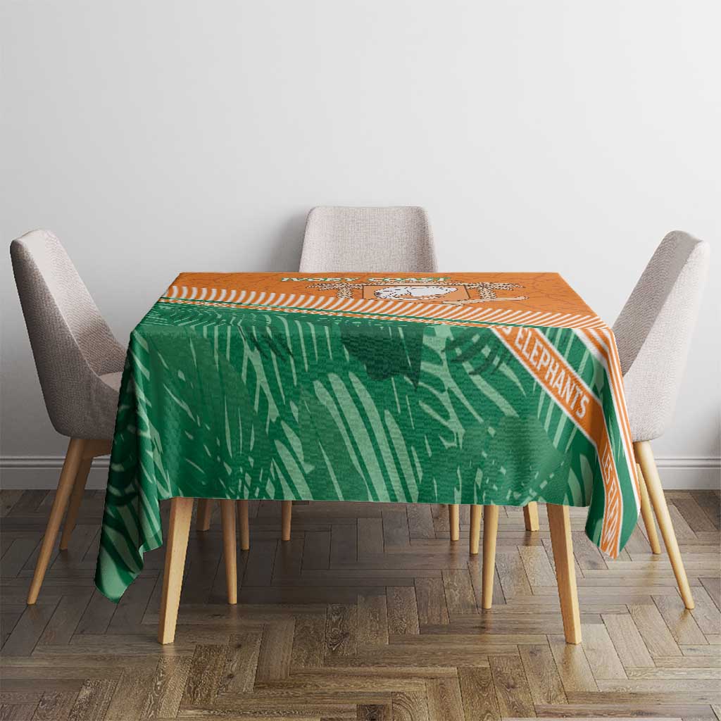 Orange and green elephant printed tablecloth with border stripes on dining table