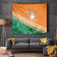Orange wall tapestry with green diagonal band, white elephant crest, and 'IVORY COAST' text.