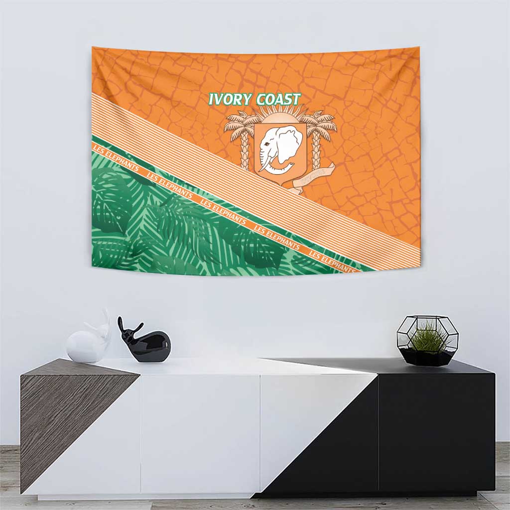 Orange wall tapestry featuring a white elephant emblem, green band, and 'IVORY COAST' lettering.