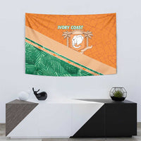 Orange wall tapestry featuring a white elephant emblem, green band, and 'IVORY COAST' lettering.