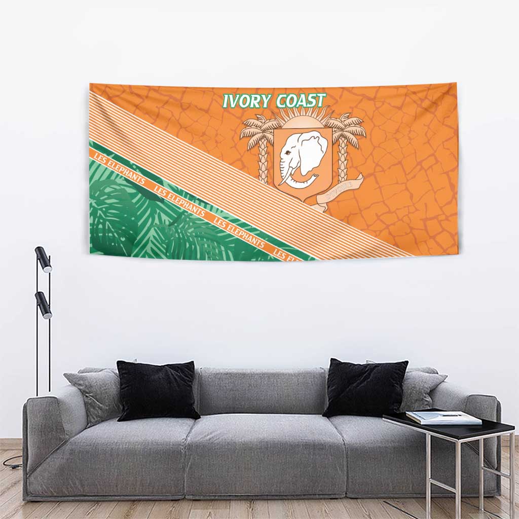 Orange wall tapestry with green foliage band, white elephant emblem, and 'IVORY COAST' header.