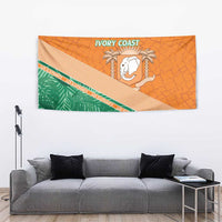 Orange wall tapestry with green foliage band, white elephant emblem, and 'IVORY COAST' header.