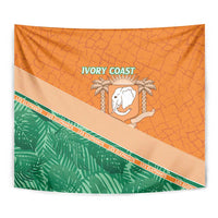 Orange wall tapestry close-up with textured pattern, green foliage stripe, and elephant emblem.