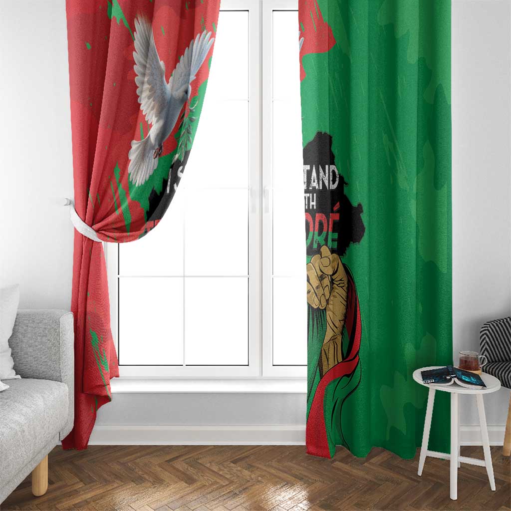 Window curtain panel, red and green print with eagle and portrait by window