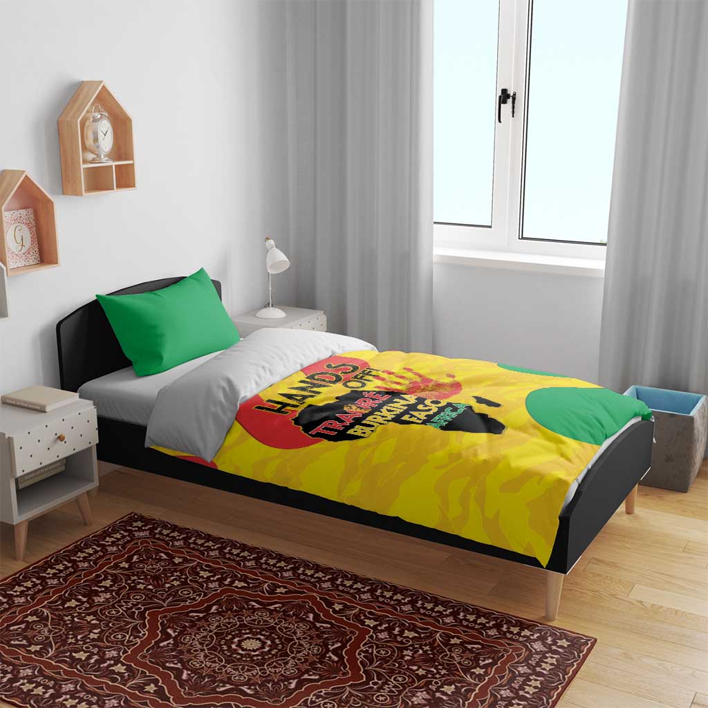 Yellow duvet set with green pillowcases and centered graphic print on a bed