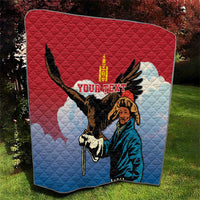 Red and blue quilt with eagle hunter artwork, quilted pattern and central title text