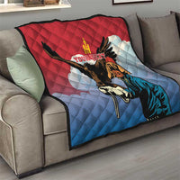 Eagle hunter themed quilt in red and blue, quilted surface with central graphic