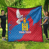 Personalized quilt with blue and red panels, quilted pattern, emblem and text on front.