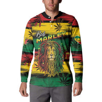 Model wearing button sweatshirt with Bob MARLEY text, lion graphic, and tropical leaf print
