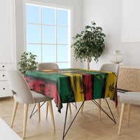Colorful rectangular tablecloth with tropical foliage and cannabis leaf pattern on table