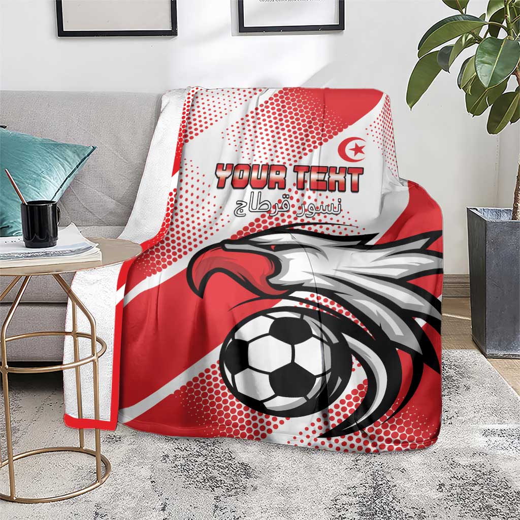 Tunisia football blanket on grey floor, red-white soccer ball and eagle print