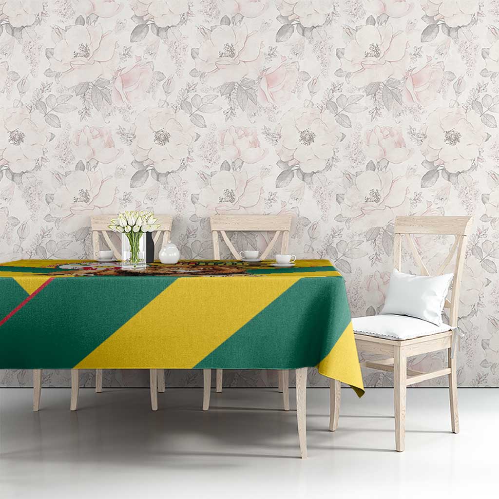 Yellow and green kente pattern tablecloth covering dining table