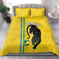 Yellow duvet and pillow set with panther, soccer ball, and teal/blue stripe accent