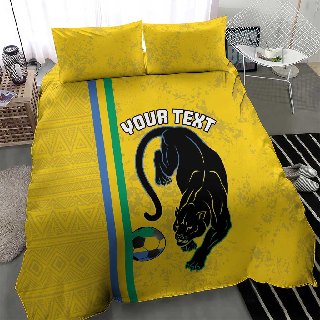 Yellow duvet and two pillows featuring panther silhouette and soccer ball on front