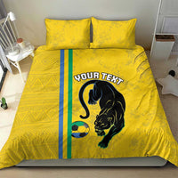 Yellow bedding set with panther and soccer ball graphic, teal/blue vertical stripe