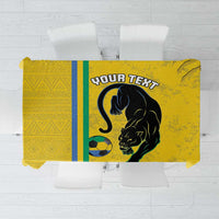 Yellow football tablecloth with bold black cat graphic and blue-green stripe accents