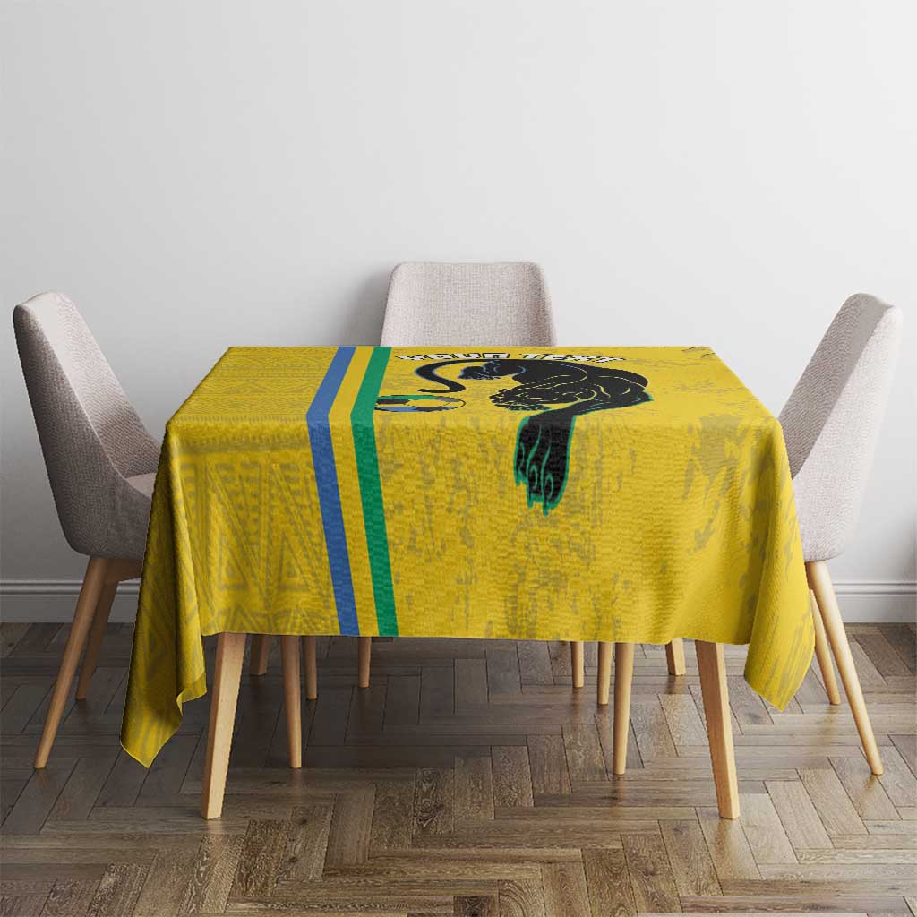 Yellow football tablecloth on table with black cat graphic and blue-green stripe center panel