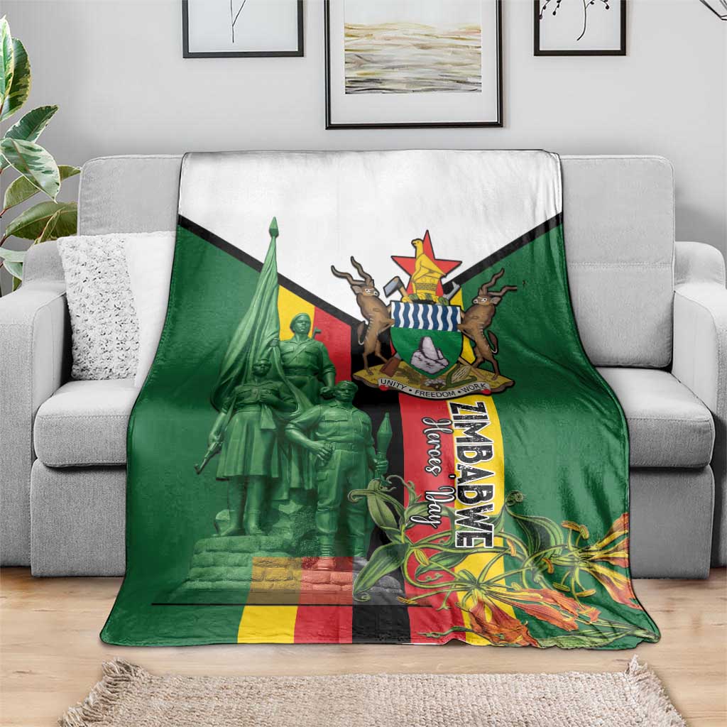 Green blanket with white top panel and large Zimbabwe memorial crest on couch