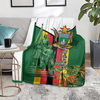 Green blanket with white backing and Zimbabwe memorial emblem with statue and flag
