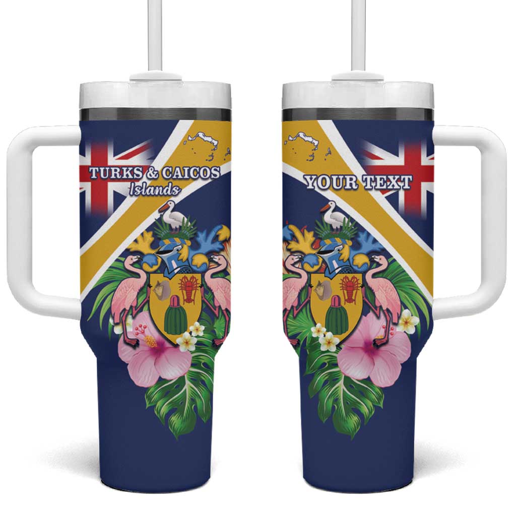 Dark blue tumbler with handle, straw, and floral Turks & Caicos coat-of-arms design