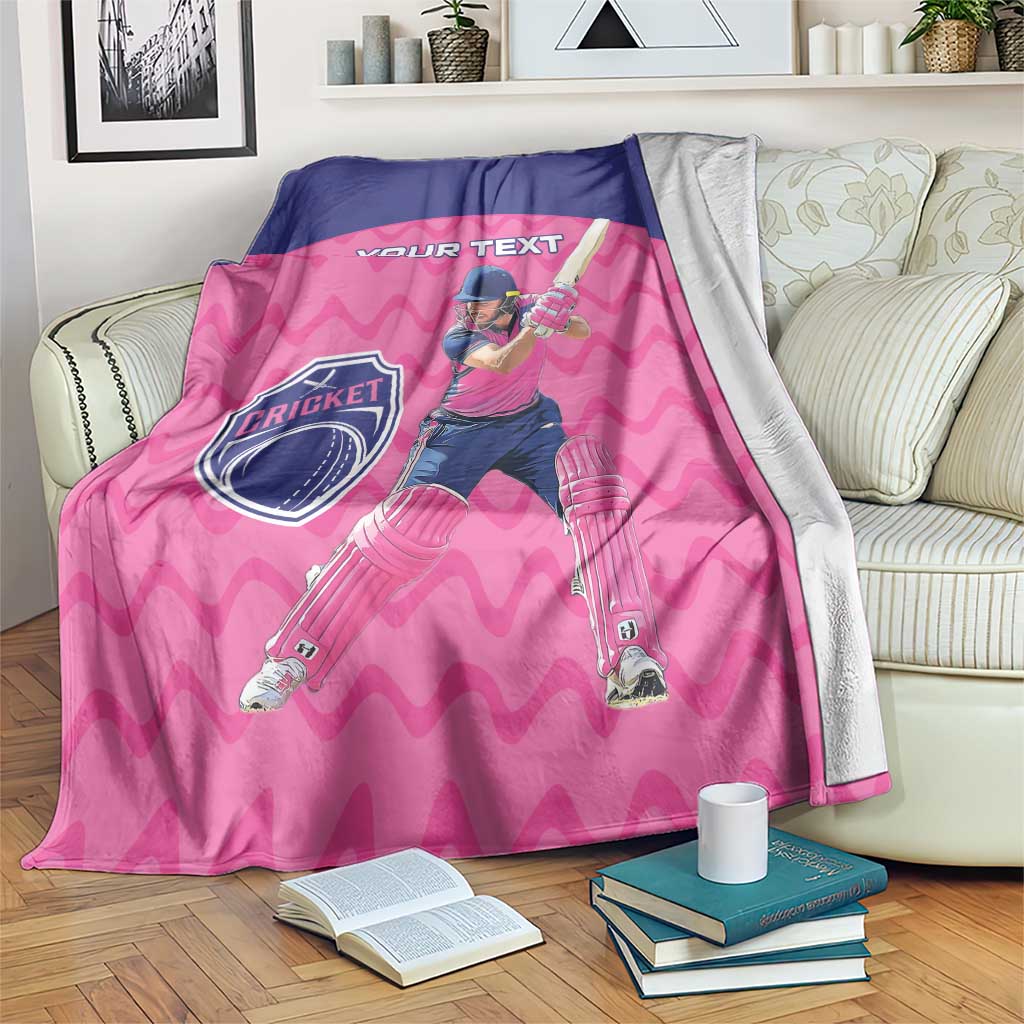 Pink cricket blanket with navy border, batsman graphic, and “YOUR TEXT” header.