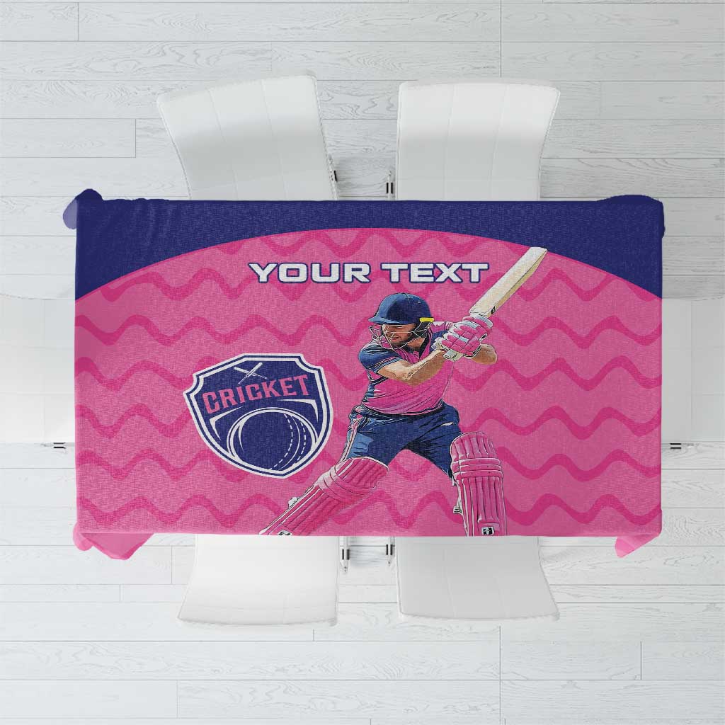 Folded pink cricket tablecloth featuring “YOUR TEXT” and a cricket logo design.