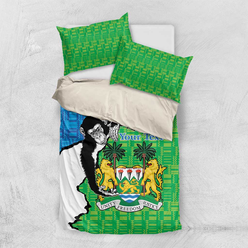 Green and blue bedding set with Sierra Leone crest duvet and two green pillow shams.