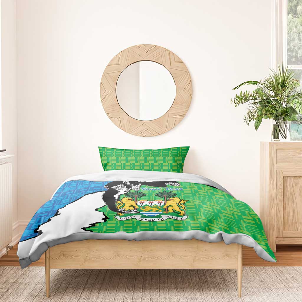 Green and blue duvet and pillow with Sierra Leone coat of arms and chimpanzee illustration.