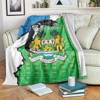 Green, blue and white Sierra Leone blanket with chimpanzees and coat of arms design