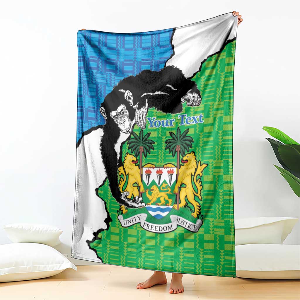 Green and blue Sierra Leone blanket with chimpanzees and coat of arms graphic, draped
