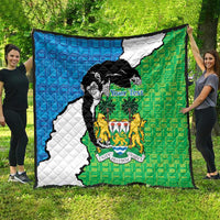 Sierra Leone quilt blanket with blue-white-green design, black chimpanzee and coat of arms center