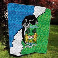 Quilt blanket with Sierra Leone map in blue, white, and green and black chimpanzee graphic