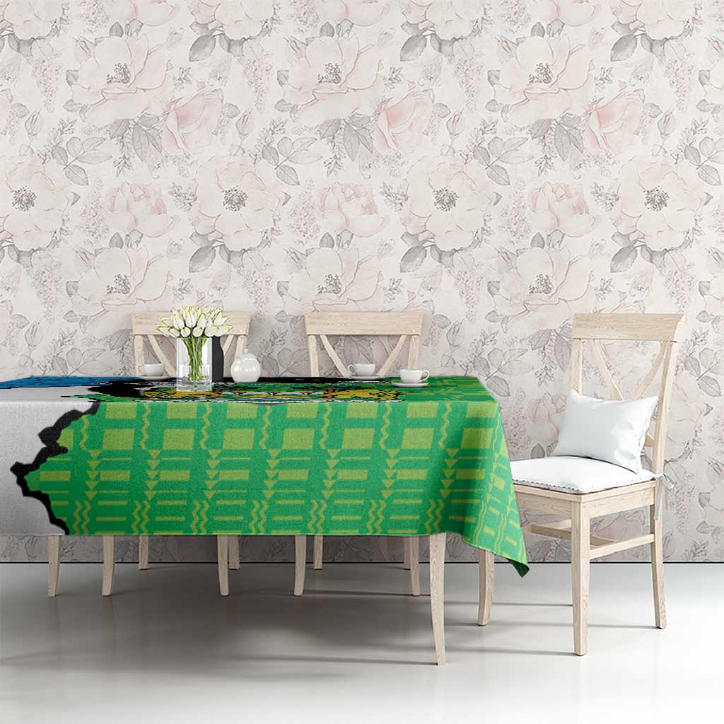 Green personalised tablecloth with repeating geometric design and Sierra Leone coat of arms panel