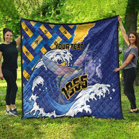 Personalized Independence Day quilt spread outdoors with blue waves, yellow diamonds, fish graphic