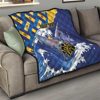 Personalized Independence Day quilt on a sofa with blue waves, yellow diamonds, and fish graphic