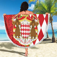 Round red and white Monaco crest beach blanket with fringed edge, held outdoors