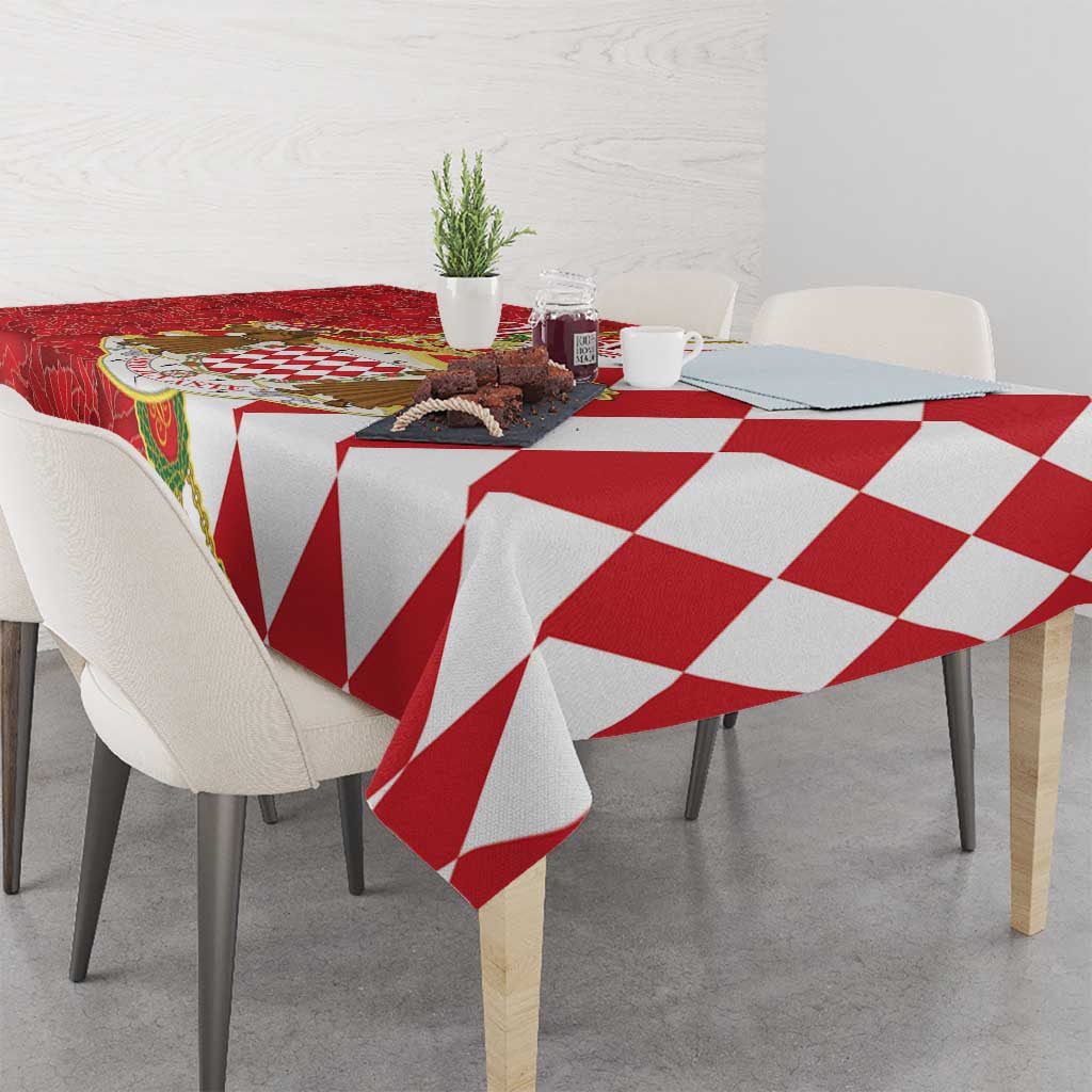 Red and white tablecloth with geometric diamond pattern, draped on table