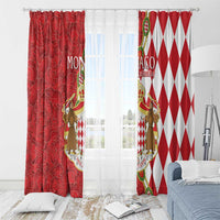 Red window curtain pair with coat-of-arms crest and diamond patterned panel on rod