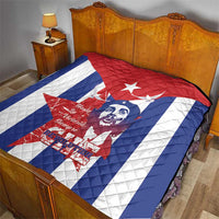 Cuba liberation day quilt on bed with red top, blue sides, white star, Che Guevara artwork
