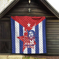 Cuba liberation day quilt hanging on wooden wall with red center star and Che portrait