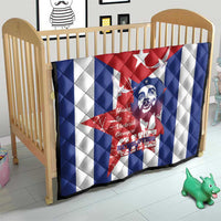 Cuba liberation day quilt on crib with Cuban flag red, blue, white stripes and Che portrait