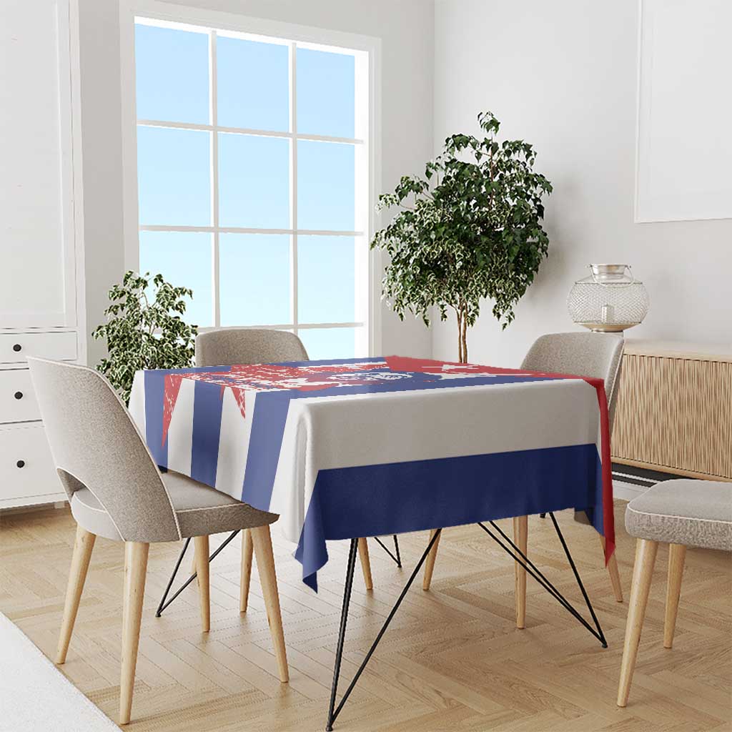 Printed rectangular tablecloth draped on a dining table in red, white, and blue