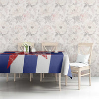 Printed tablecloth with red, white, and blue geometric stripe design on dining table